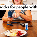 15 best snacks for people with diabetes including nuts, yogurt, and fruits arranged on a wooden table.